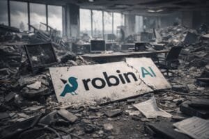 Robin AI slump. A damaged office with debris and broken computers; a large cracked sign with "robin AI" lies among the rubble.