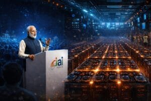 An official speaks at a podium labeled "India AI" in a large, futuristic hall filled with rows of illuminated computer servers and an audience.