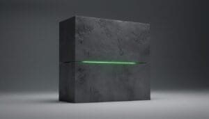 A dark, textured rectangular block is split horizontally by a thin green glowing line, set against a plain gray background.