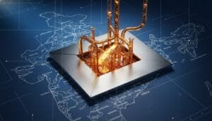 A metallic microchip with copper pipes is positioned over a map of India, symbolizing technology integration and infrastructure development in the region.